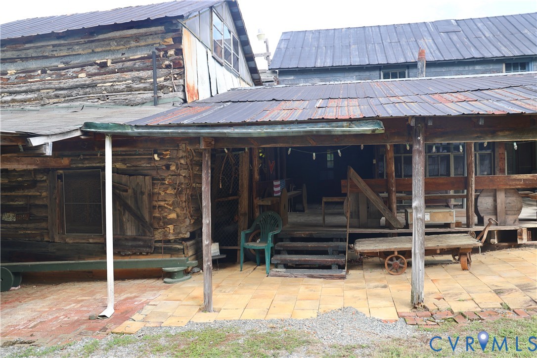 7246 MacDonald Road Scottsburg, VA 24589 - Photo 38 of 46 a view of a house with door and wooden walls