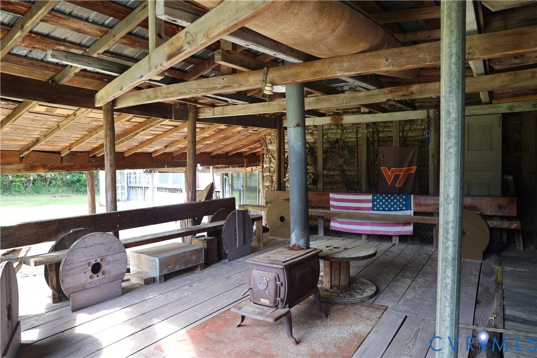 7246 MacDonald Road Scottsburg, VA 24589 - Photo 7 of 46 a building outdoor space with patio furniture and a potted plant