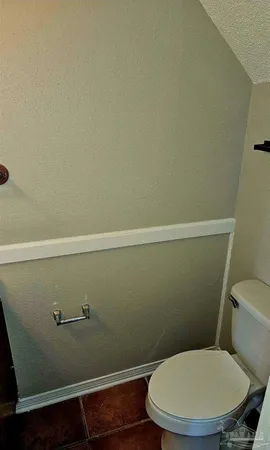 a bathroom with a toilet and a sink