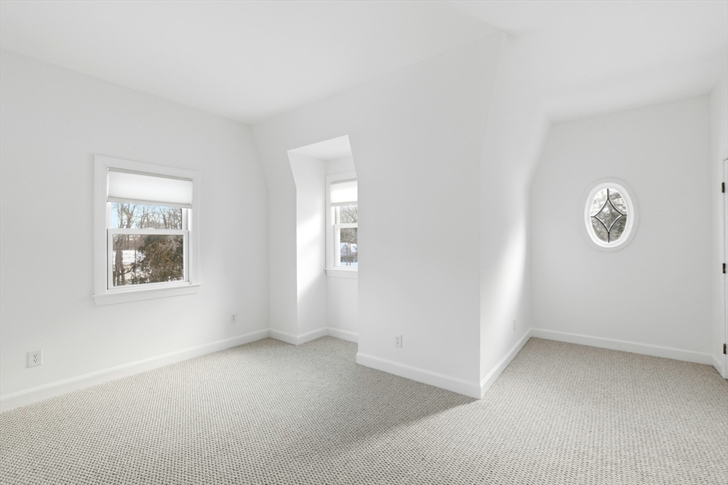 74 Branch Street, Unit 15 Scituate, MA 02066 - Photo 19 of 26 an empty room with windows