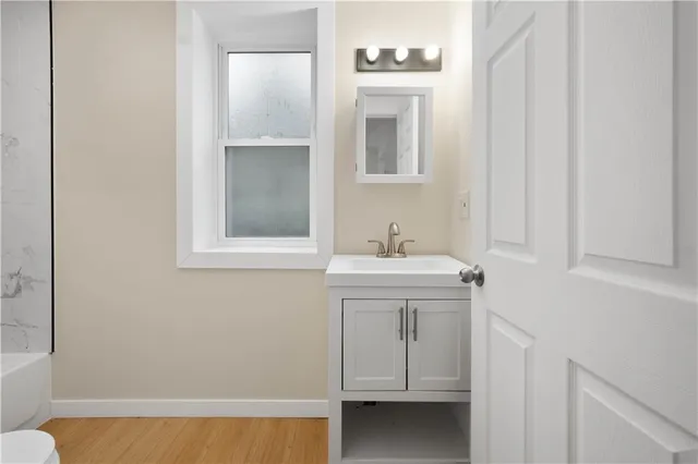 a bathroom with a sink toilet and vanity