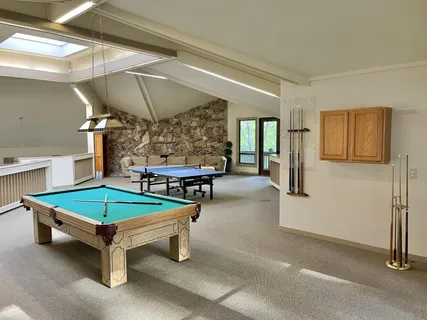 a room with table and chairs