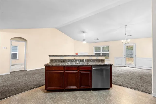 a kitchen with a stove and a sink