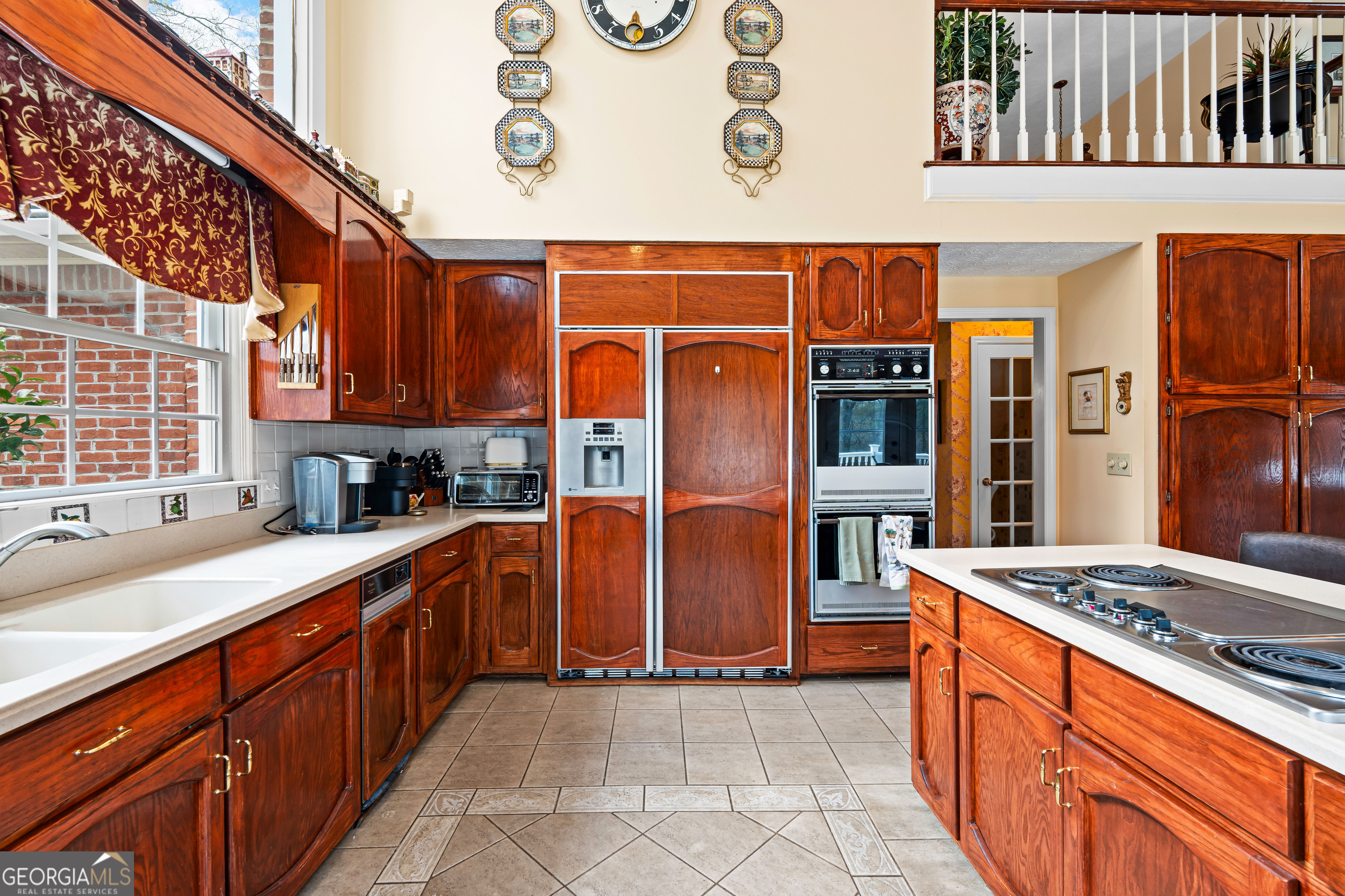 296 Ebenezer Church Road Fayetteville, GA 30215 - Photo 11 of 66 a large kitchen with stainless steel appliances granite countertop a stove and cabinets