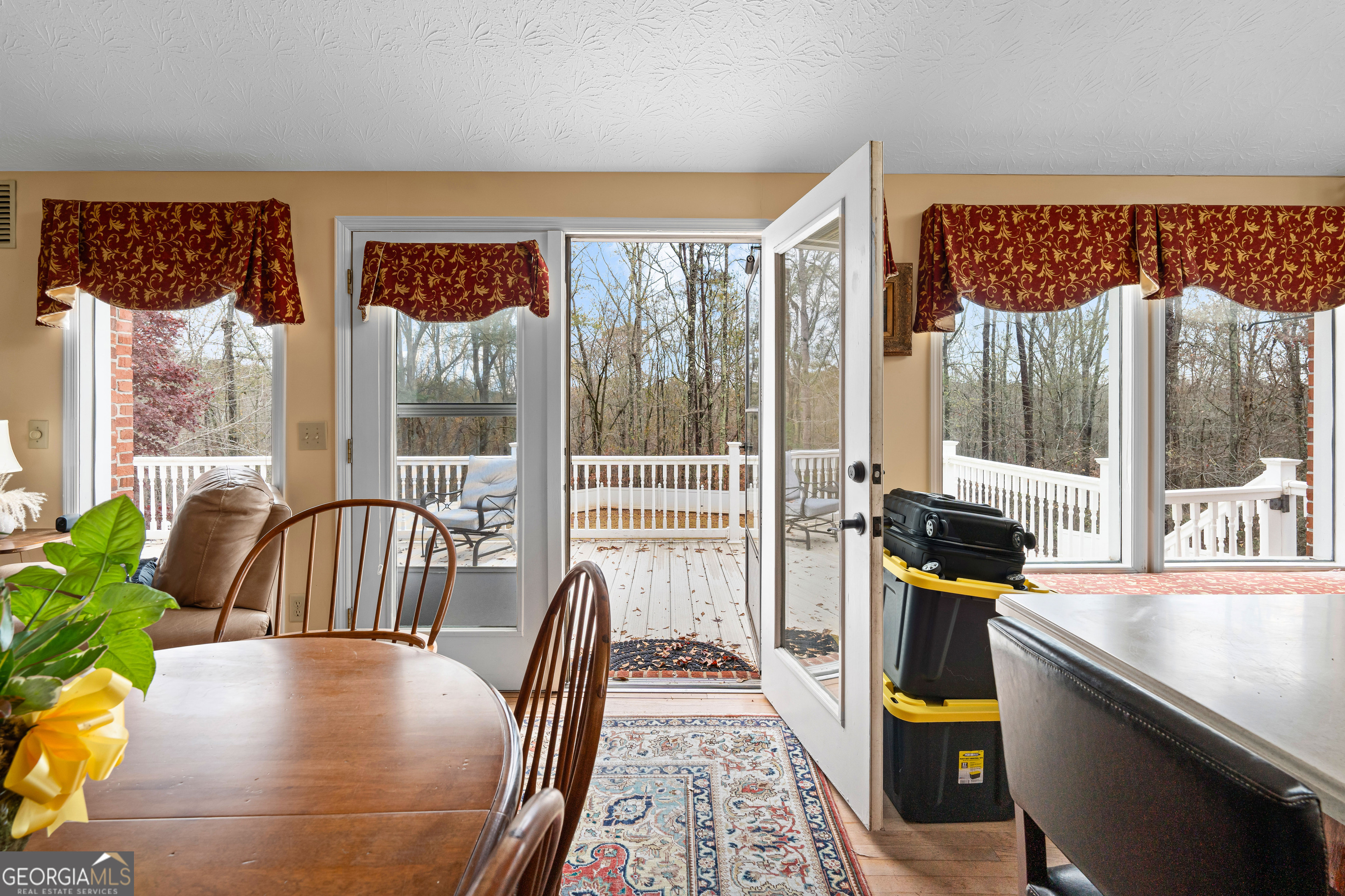 296 Ebenezer Church Road Fayetteville, GA 30215 - Photo 16 of 66 a living room with furniture and a floor to ceiling window