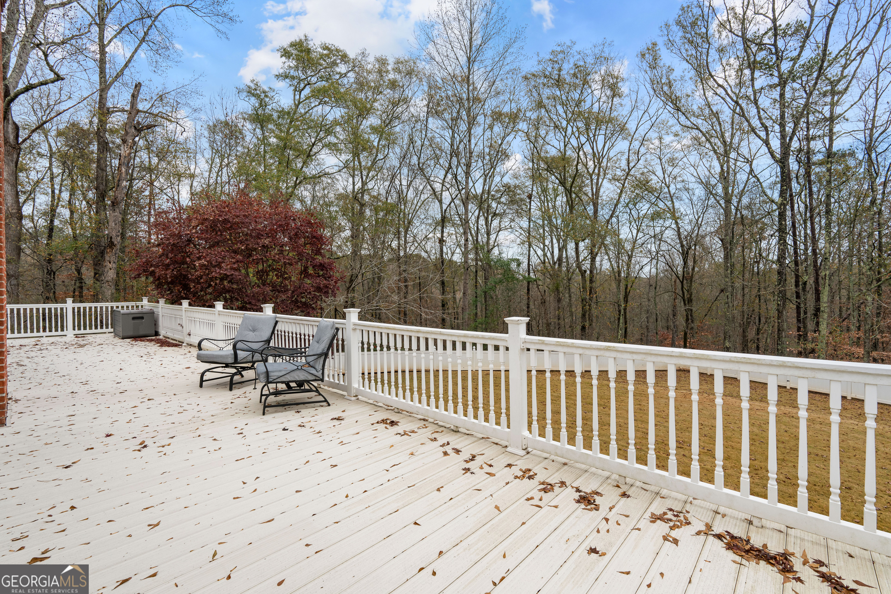 296 Ebenezer Church Road Fayetteville, GA 30215 - Photo 17 of 66 a bench sitting in middle of a yard