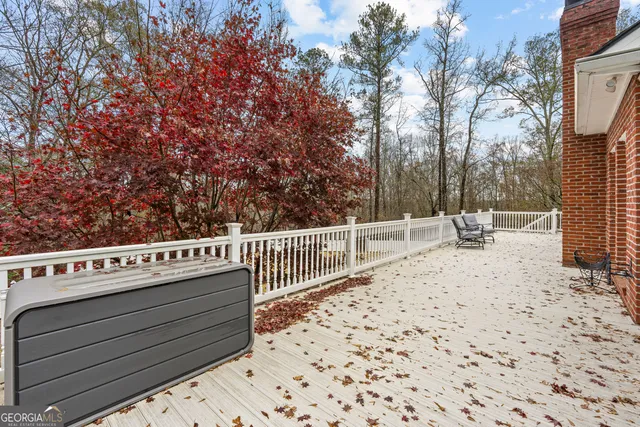 a living room with furniture and a dresser