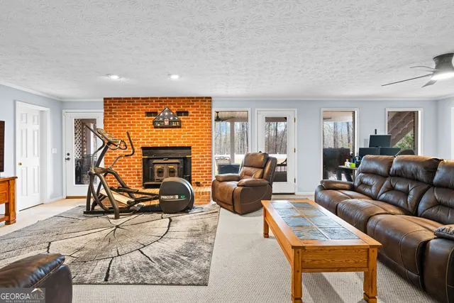 a view of a hallway with wooden floor and entryway