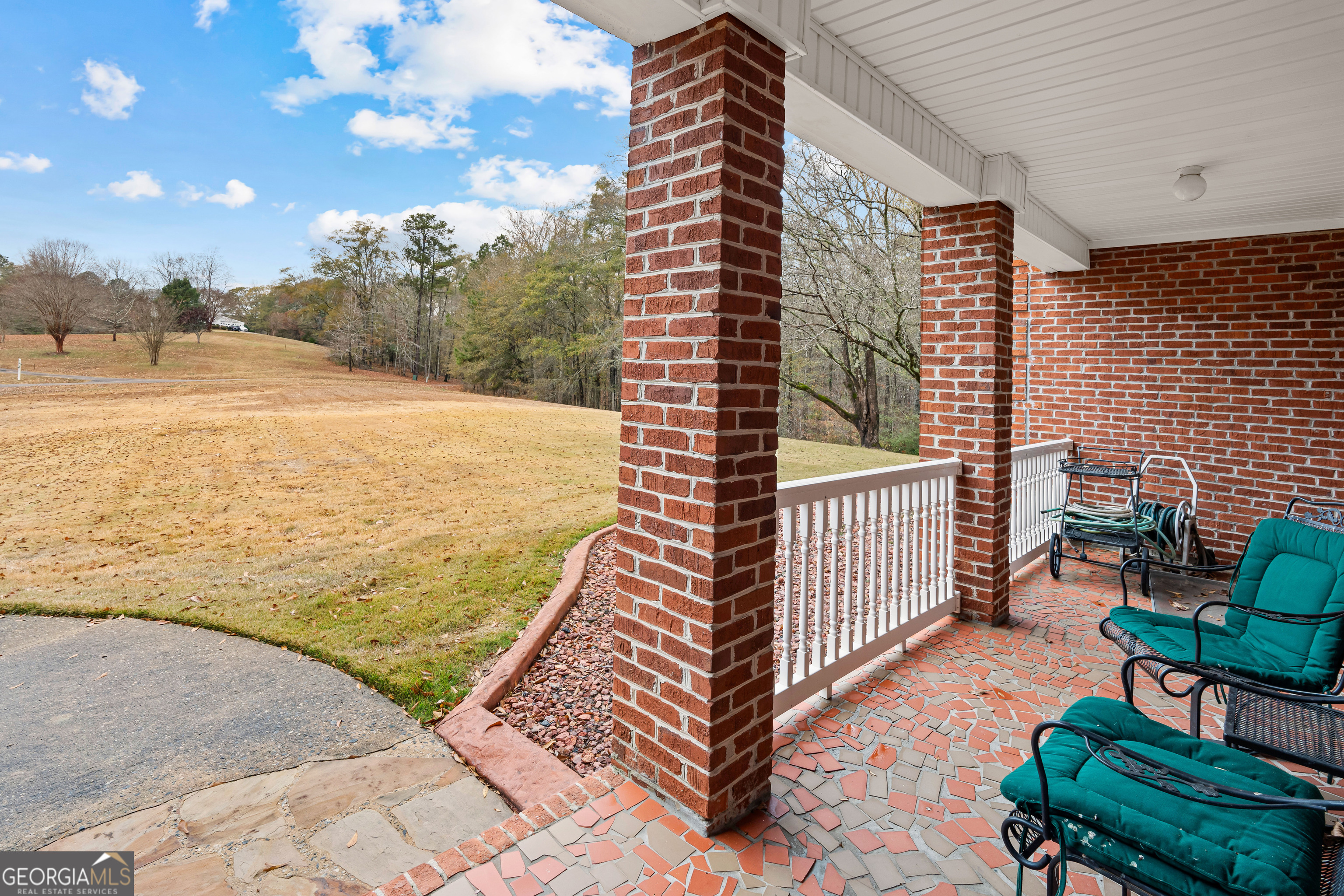 296 Ebenezer Church Road Fayetteville, GA 30215 - Photo 33 of 66 a view of a balcony with chairs
