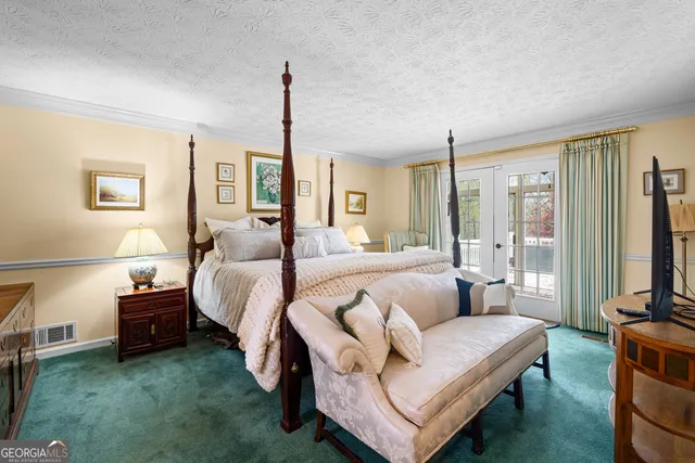 a bed room with a bed and a couch