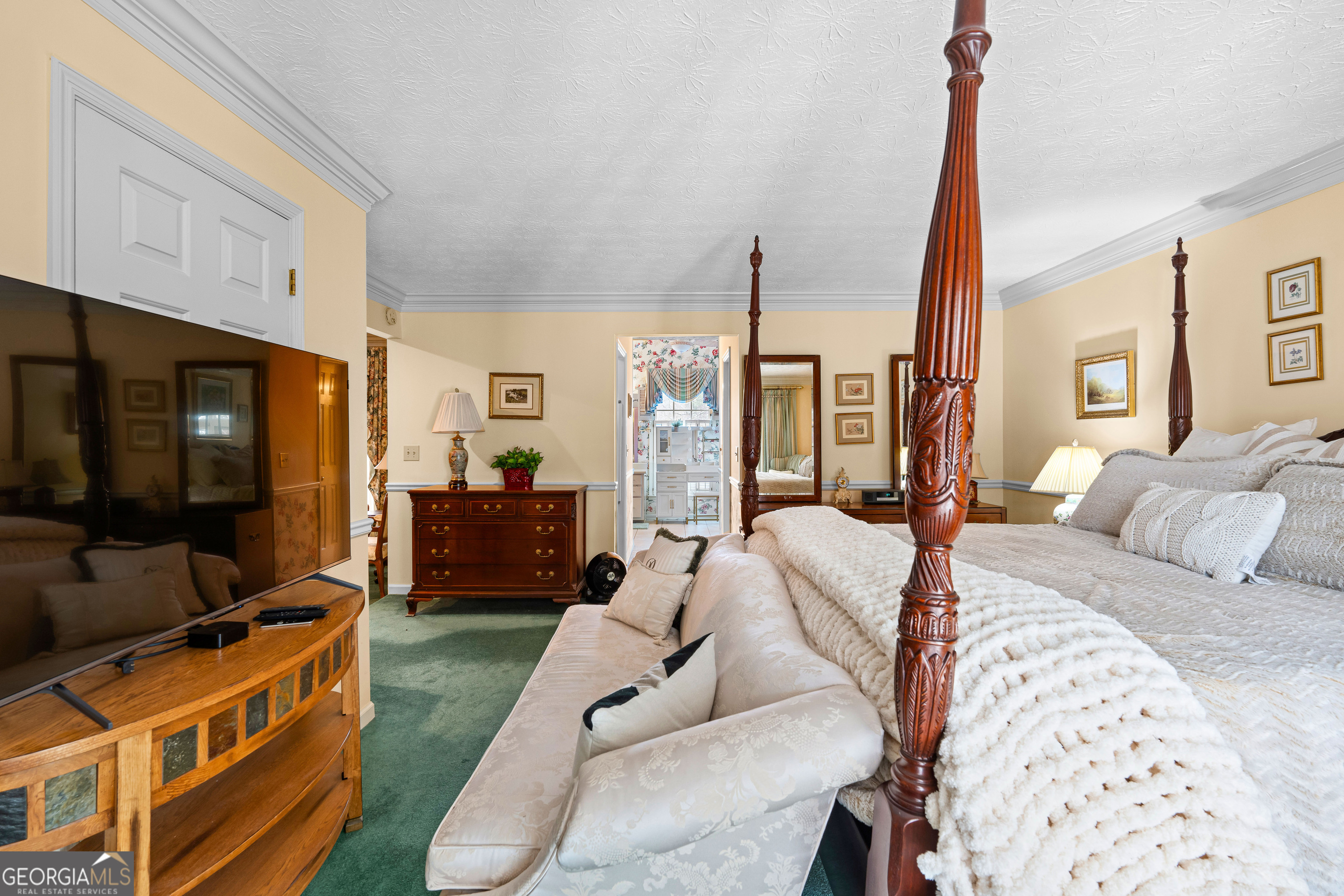 296 Ebenezer Church Road Fayetteville, GA 30215 - Photo 40 of 66 a bed room with furniture and a flat screen tv