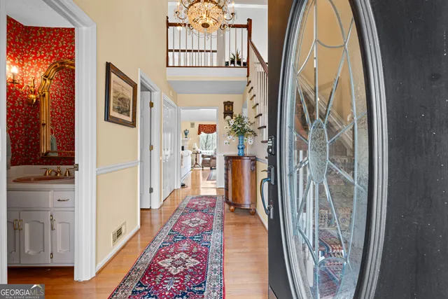 a view of an entryway with a floor to ceiling window