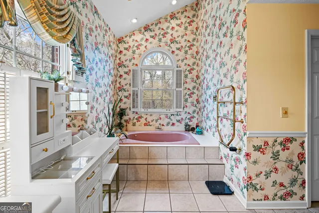 a view of a house with a yard covered in snow