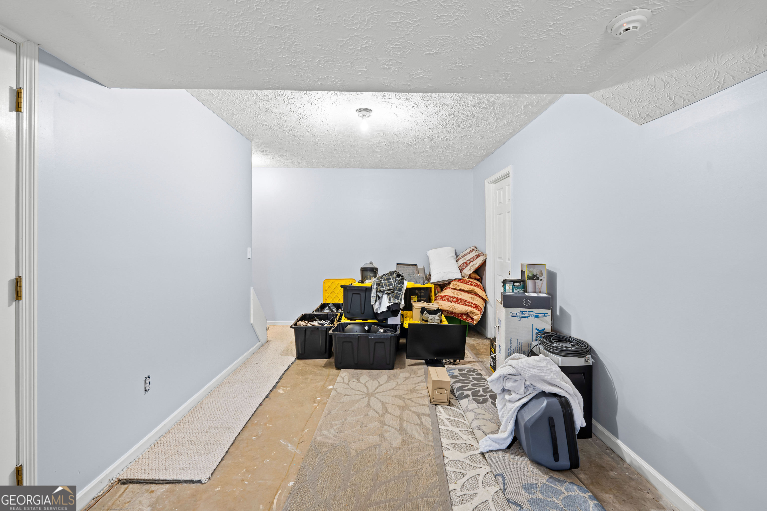 296 Ebenezer Church Road Fayetteville, GA 30215 - Photo 46 of 66 a bed room with a bed and a couch