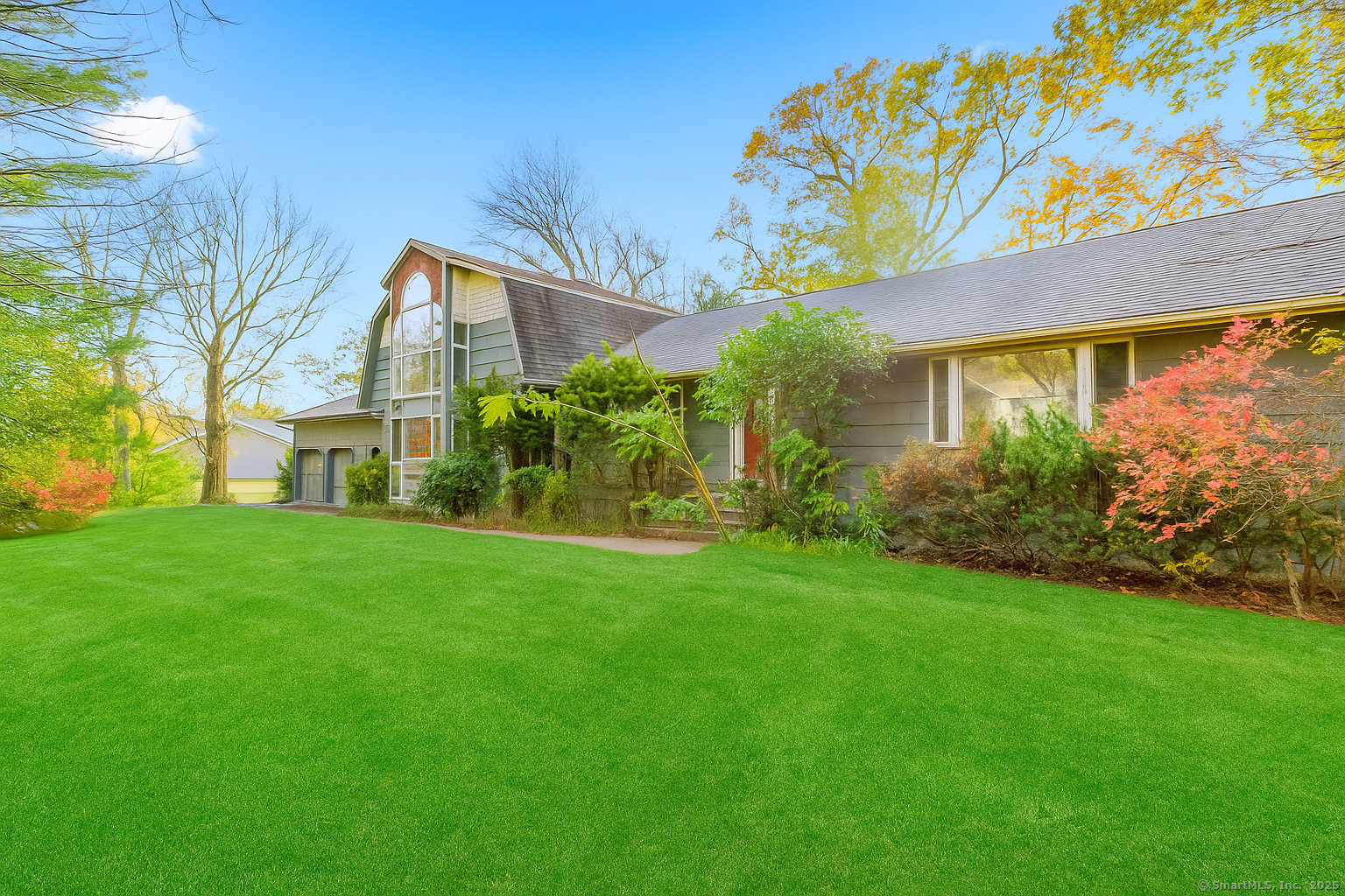 a front view of a house with garden