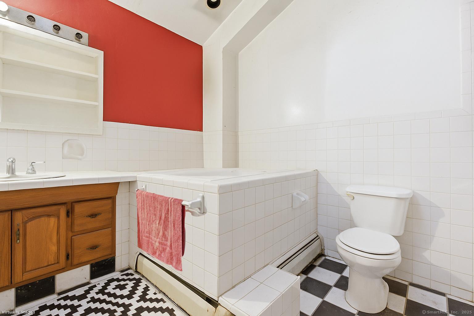 184 Putting Green Road Trumbull, CT 06611 - Photo 13 of 24 a bathroom with a sink toilet and vanity