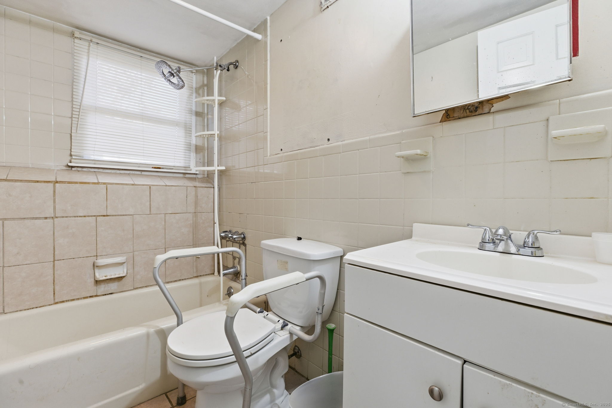 184 Putting Green Road Trumbull, CT 06611 - Photo 15 of 24 a bathroom with a sink a toilet and shower