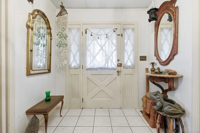 a view of an entryway with wooden floor