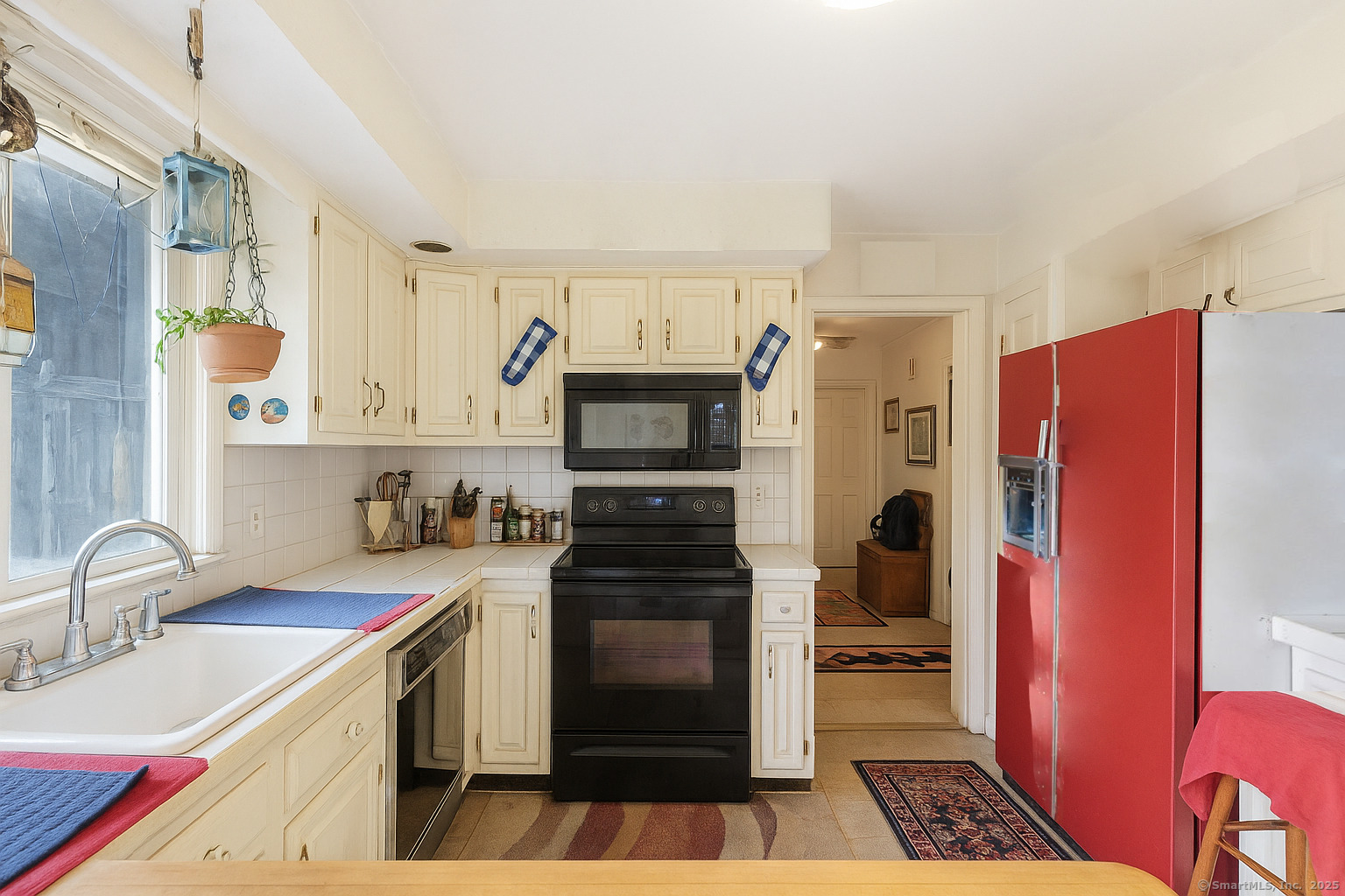 184 Putting Green Road Trumbull, CT 06611 - Photo 4 of 24 a kitchen with stainless steel appliances a refrigerator stove and sink