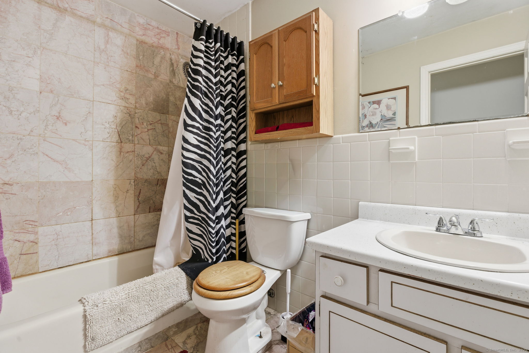 184 Putting Green Road Trumbull, CT 06611 - Photo 7 of 24 a bathroom with a sink a toilet and shower
