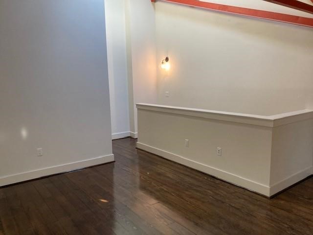 4411 Dallas Street, Unit 44 Houston, TX 77023 - Photo 15 of 16 a view of an empty room with wooden floor