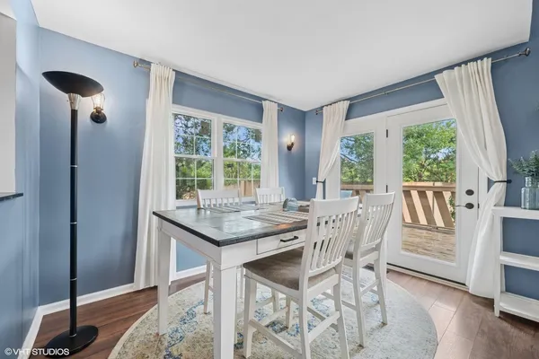 a view of a dining room with furniture window and wooden floor
