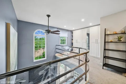 a view of a hallway with furniture and window