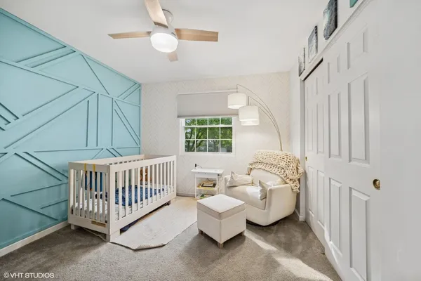 a bed room with furniture and a window