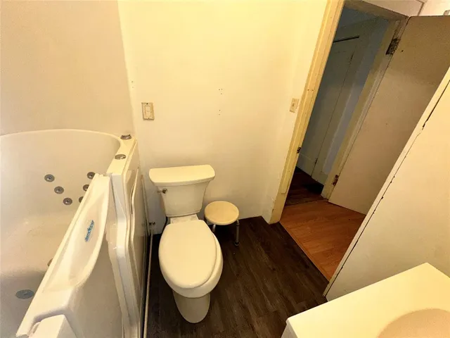 a bathroom with a toilet and a sink