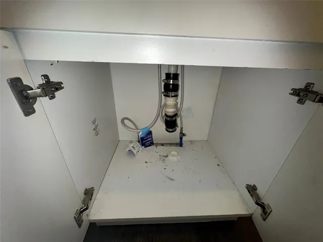 a bathroom with a sink and washing machine