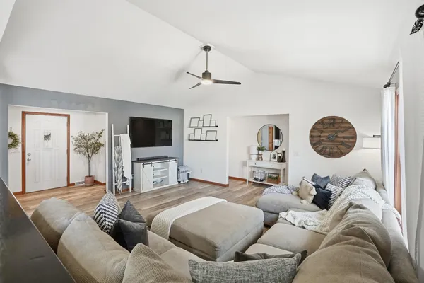 a kitchen with stainless steel appliances granite countertop a sink a stove and a refrigerator