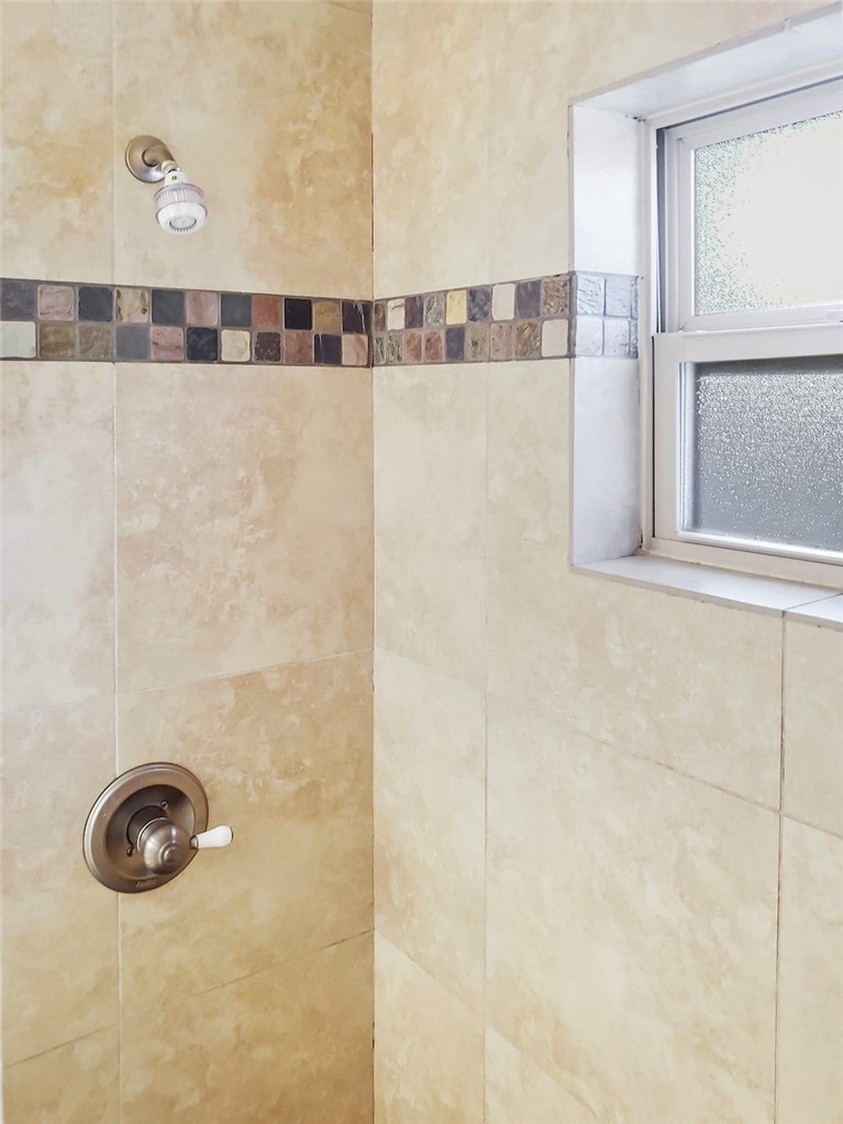 2414 Longview Street, Unit 206 Austin, TX 78705 - Photo 11 of 17 a bathroom with a shower