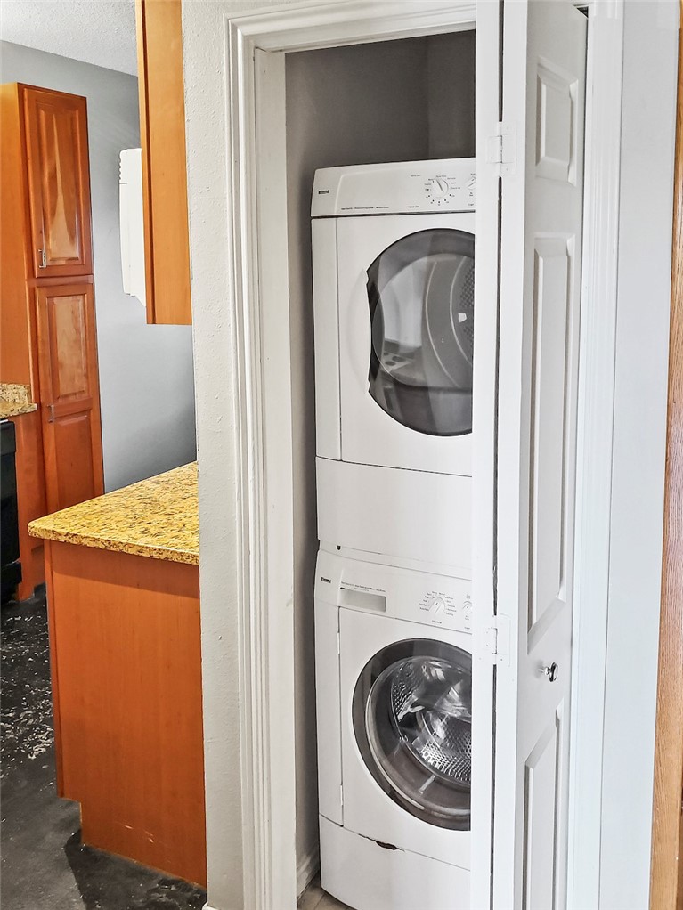 2414 Longview Street, Unit 206 Austin, TX 78705 - Photo 4 of 17 a utility room with dryer and washer