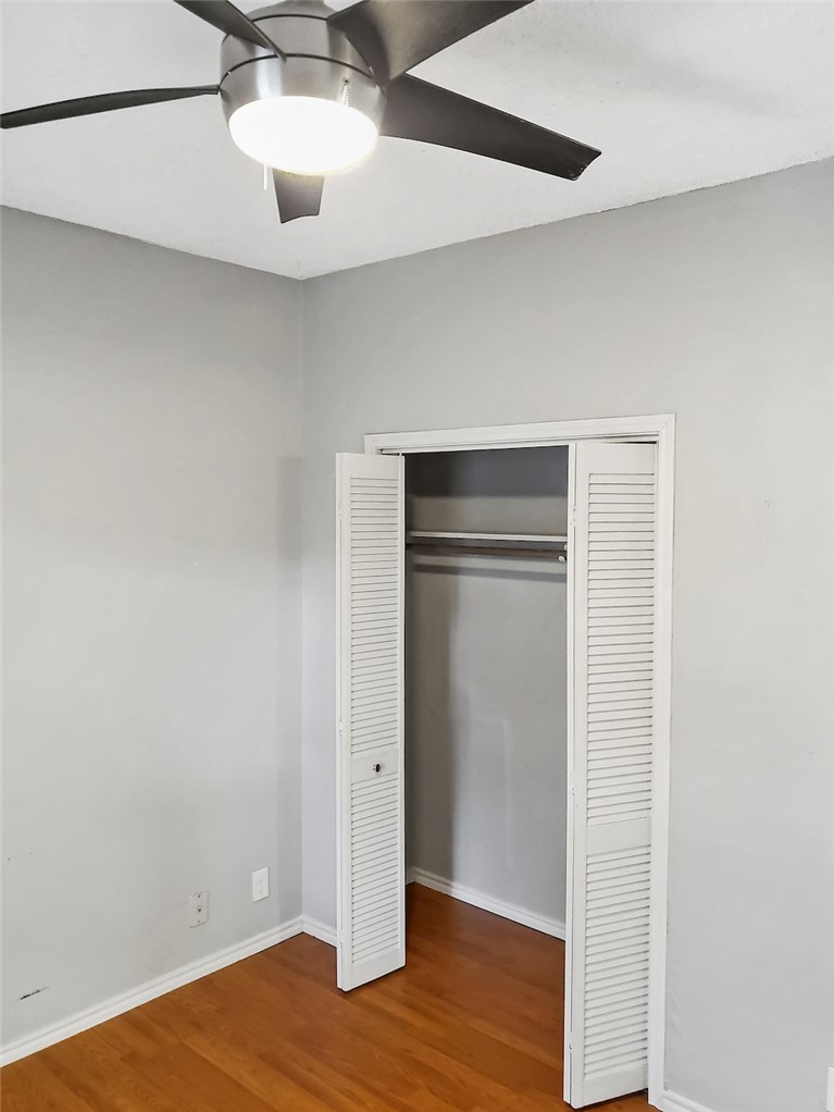 2414 Longview Street, Unit 206 Austin, TX 78705 - Photo 9 of 17 a view of an empty room with wooden floor
