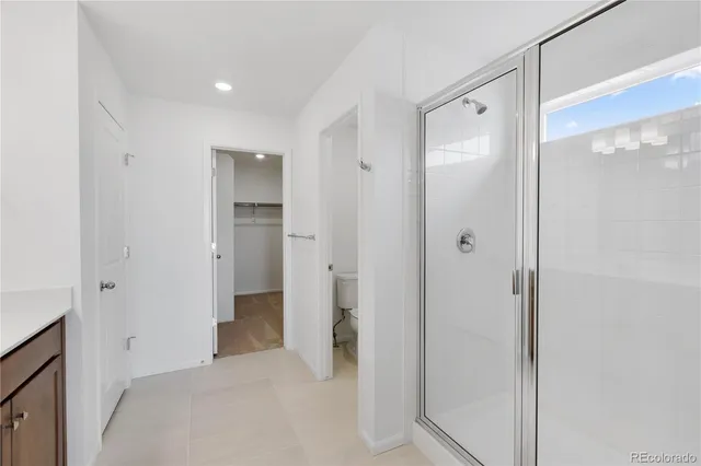 a view of a bathroom with a shower and a sink