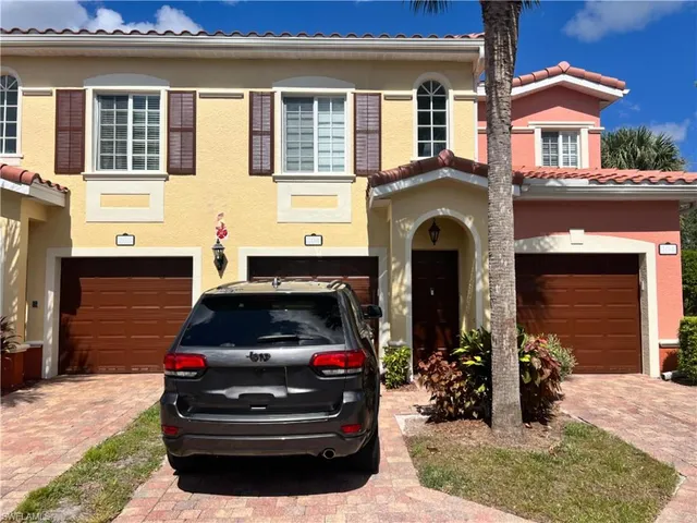 a car parked in front of a house