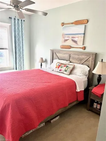 a bedroom with a bed and a mirror