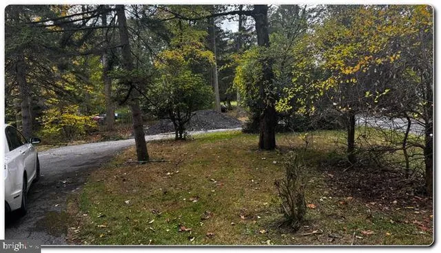 a view of room with window and hallway