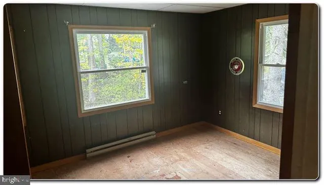 a bathroom with a granite countertop toilet and a sink