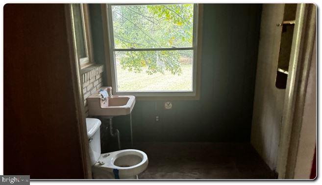 4759 Sheeprock Road Macungie, PA 18062 - Photo 20 of 24 a bathroom with a granite countertop toilet and a sink