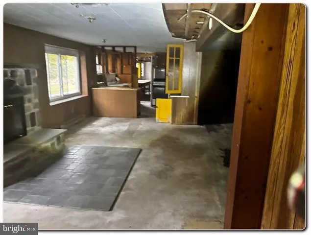 a view of a kitchen with furniture and windows