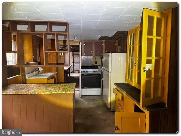 a view of room with a flat tv screen and a dresser