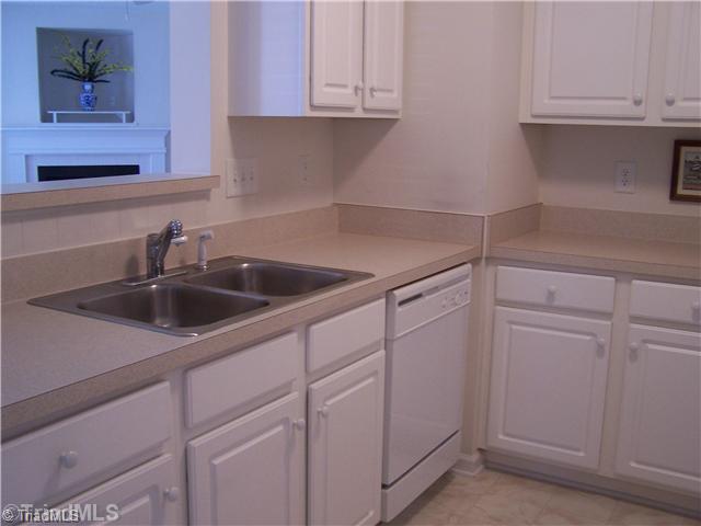 125 James High Point, Unit 1B High Point, NC 27265 - Photo 11 of 16 Kitchen. Another view of the kitchen that is open to the dining room.