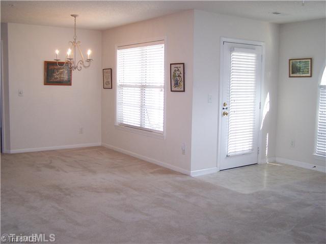 125 James High Point, Unit 1B High Point, NC 27265 - Photo 6 of 16 Entry. Entry from the patio into the living room and dining room area.