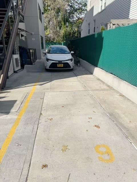8794 17th Avenue, Unit 101 Brooklyn, NY 11214 - Photo 7 of 8 a car parked on the side of the road