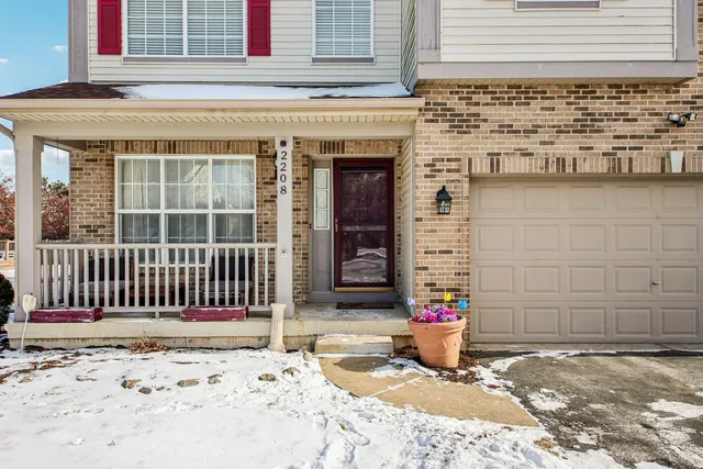 a front view of a house with a garage