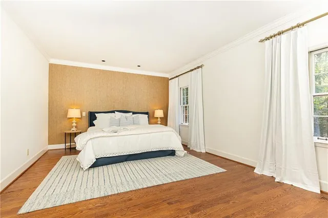 a bedroom with a bed and a table