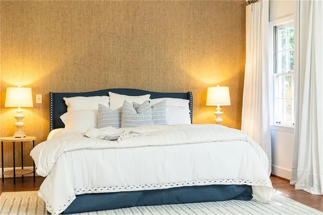 a bathroom with a toilet sink vanity and mirror