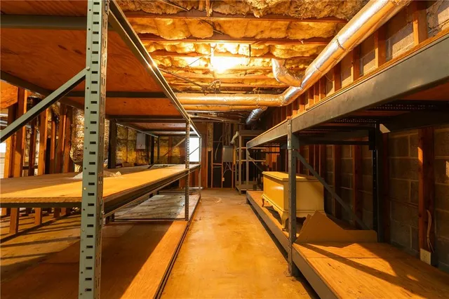 a front view of a house with a yard and a garage