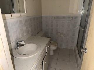 5300 Washington Street, Unit C213 Hollywood, FL 33021 - Photo 8 of 15 a bathroom with a sink a toilet and shower